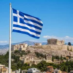 Greek flag with Athens Acropolis skyline.