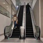 Escalator in a public indoor setting.