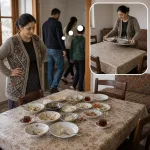 Woman after a family meal thinks about herself clearing the table later.